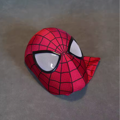 Spider-Man mask on a gray surface