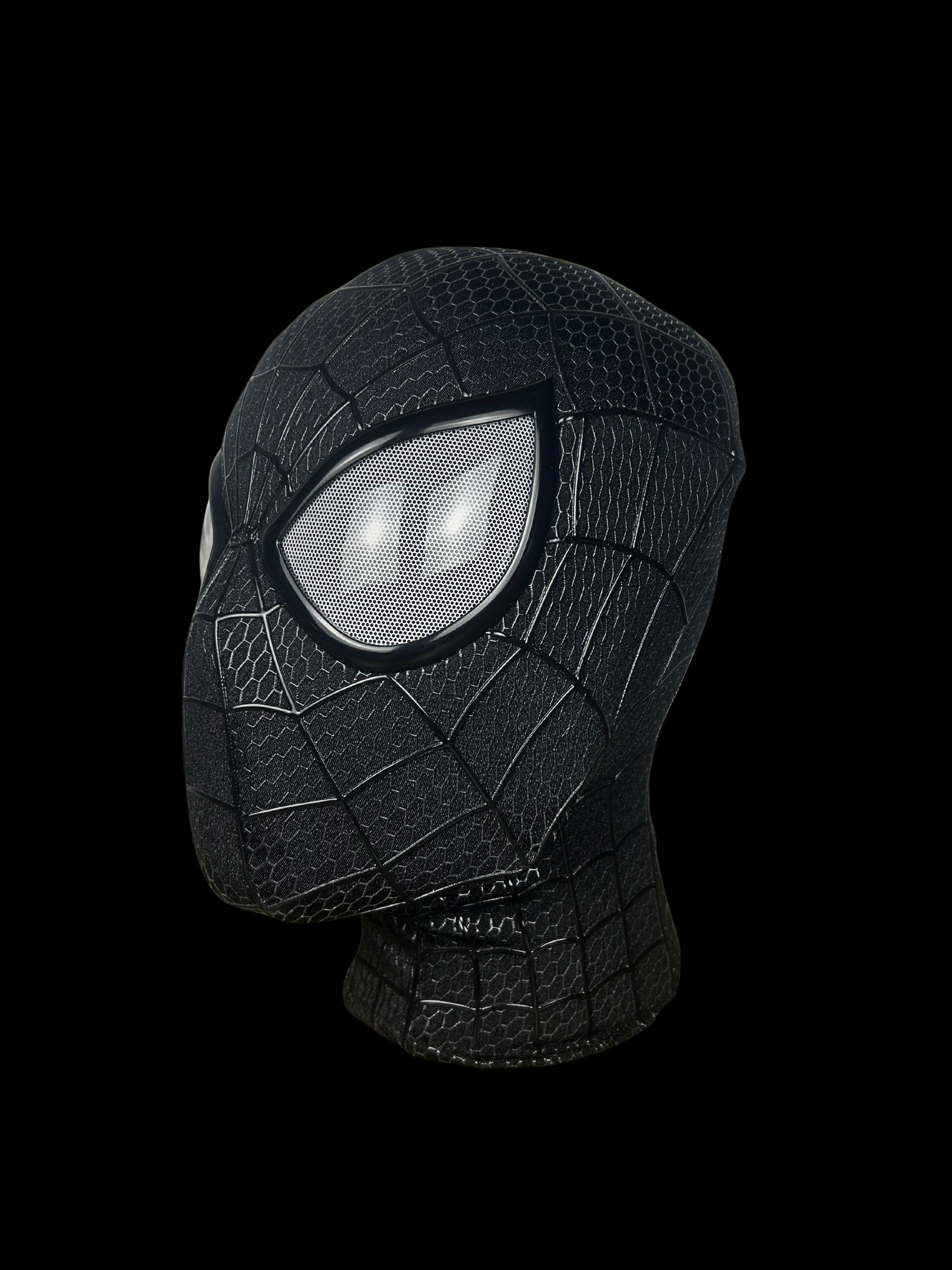 Black spider-themed mask with detailed design on a black background
